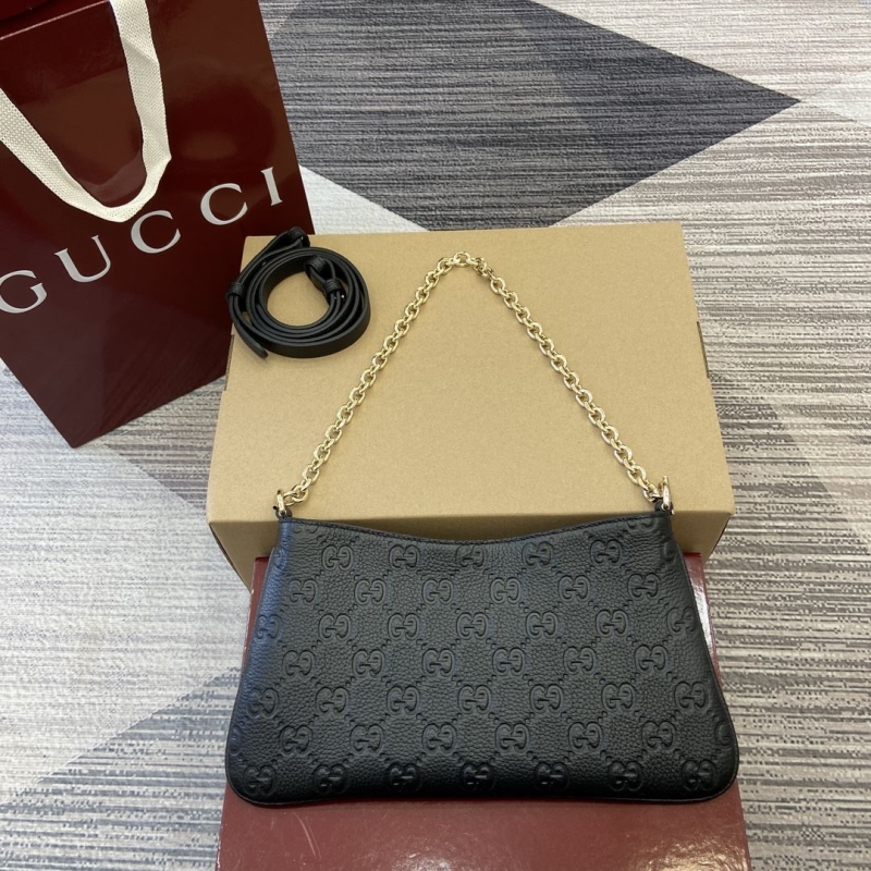 G*u*i top handle bags
